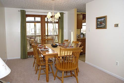 Dining Room with French Doors leading to Screened-In Deck