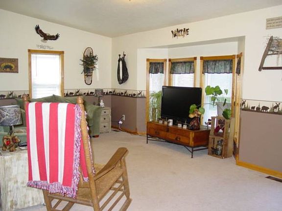 The living room is roomy (12x22) and it looks out into the woods.