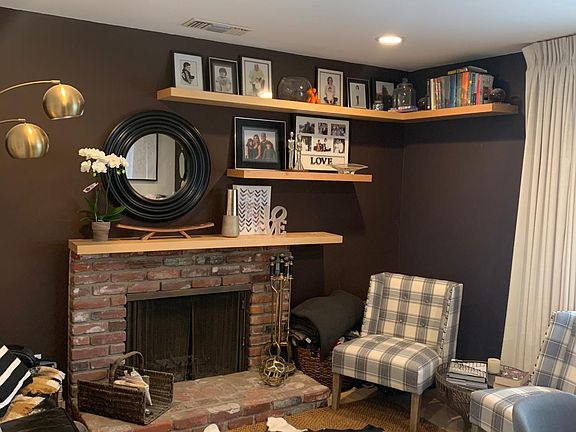 Wood burning fireplace in living room f