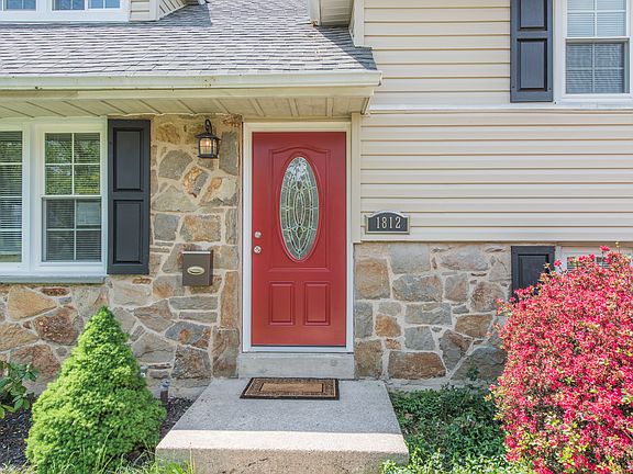 Welcoming front porch with updated landscaping