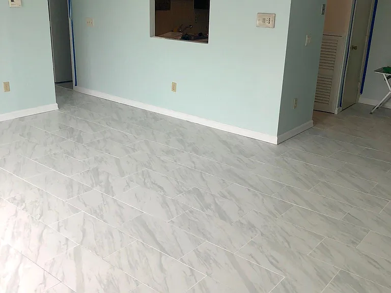 Overview of the living room and looking at the kitchen with