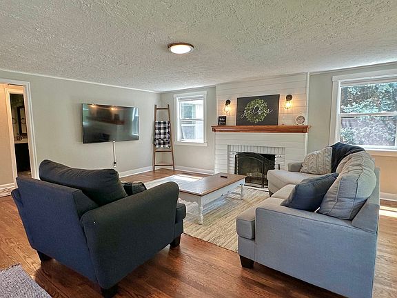 Living with 65" TV and Fireplace