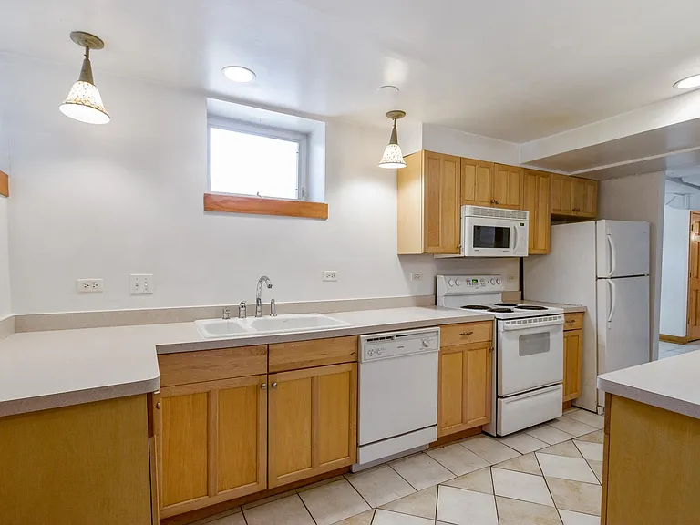 Custom Kitchen. All high end appliances. Kohler sink, built in buffet for serving. Quarry Stone Flooring,