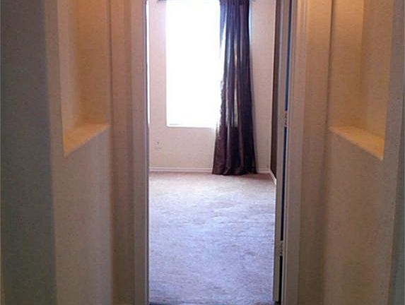 Walk down this hallway off of the living room into the master suite.