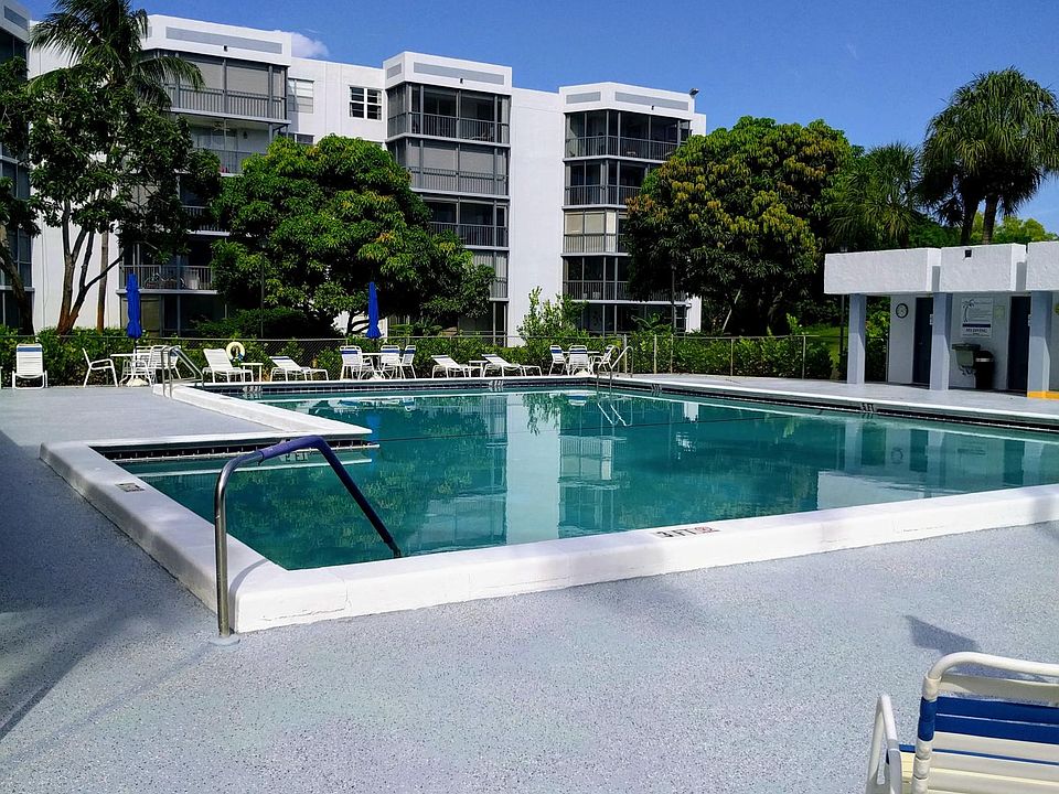 Beautiful nearby community pool area with large lap pool, shaded seating, showers, changing & rest rooms.