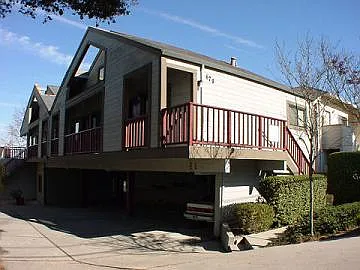 Front of Property. Carports under building.