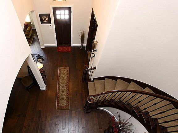  Grand Stairway & Elegant Entry. Notice the Hand Scrapped Wood Floors