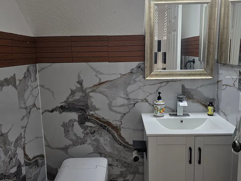 Ground Floor Half Bath - Tankless toilet with touchless flush and auto on/off lights