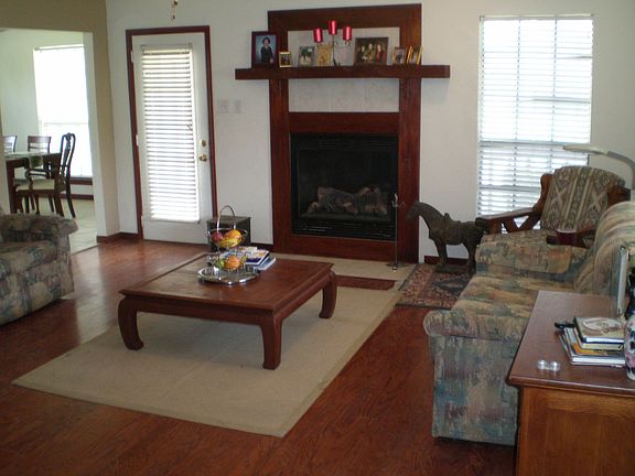 Pretty den with wood laminate floors!