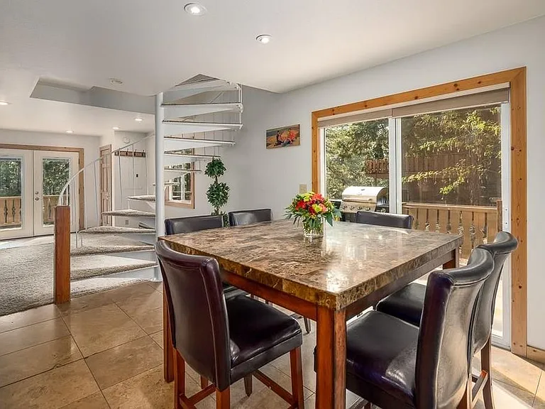 Dining area and spiral staircase.