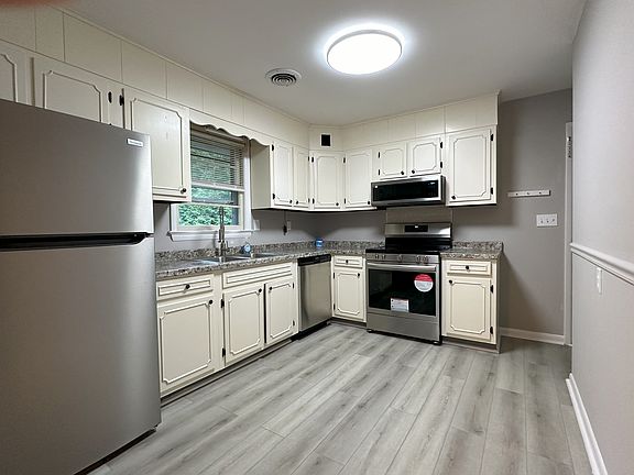Updated kitchen with brand new fridge, oven, microwave, dish washer.