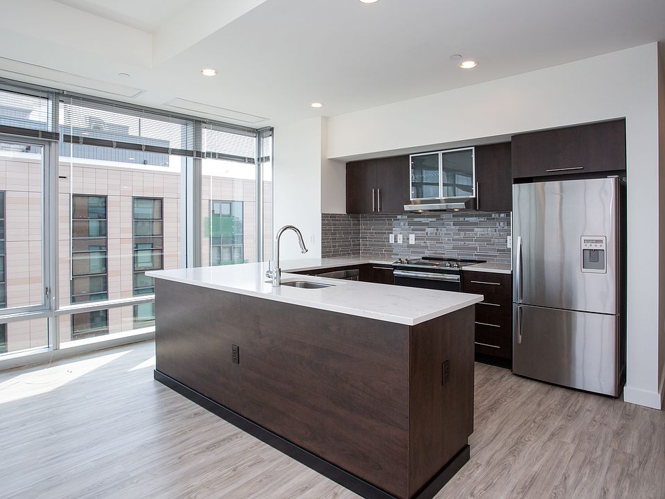Completely updated kitchen with stainless steel appliances, wrap around island and breakfast bar.