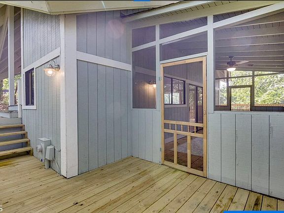 Right side of house, just past front door