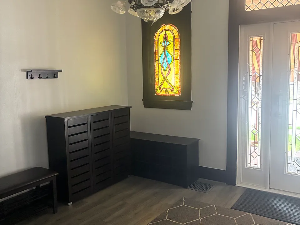 Entrance - Foyer with cabinets. bench and shelving
