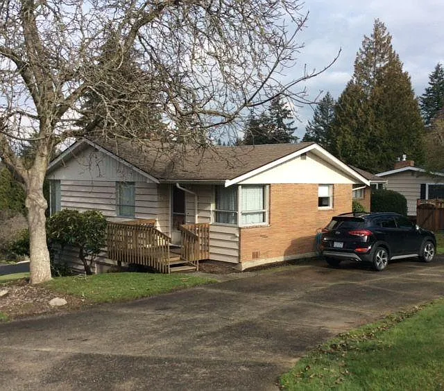 Front of home with plenty of parking, access to front of house off of SW Normandy Rd