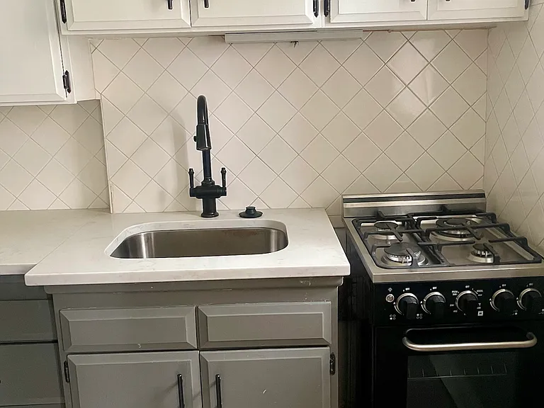 Kitchen Interior with Stove and Farmhouse-Style Hardware Kitchen Interior with Stove and Farmhouse-Style Hardware