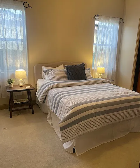 New Queen sized bed with attached bathroom and walk-in closet.