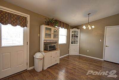 This kitchen is cute and cozy offering: Brand new countertops, access door to the deck offers  blinds contained in the windows, storm door with sliding window that exposes a screen. Other great features include oak cabinetry, ceiling fan and garden view window overlooking the backyard. Best of all you can save your money because the sellers are kind enough to leave all of the kitchen appliances. Set up a showing today and take advantage of this price and the amenities this home has to offer.