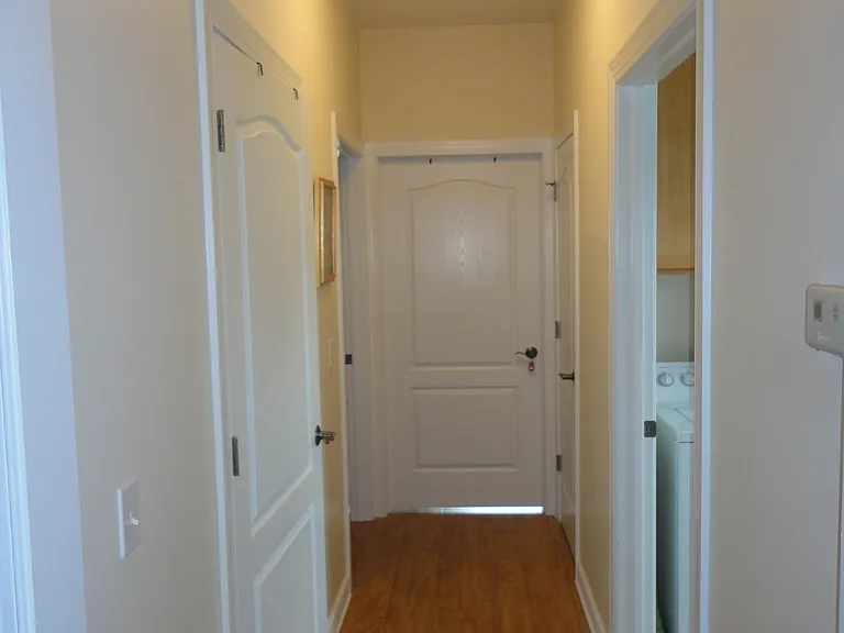 Hallway back to laundry on right - Full bath on left -2nd bed straight ahead & main bed with walkin