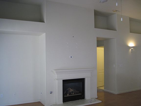 Living Room with Hardwood floors and Vaulted Ceilings
