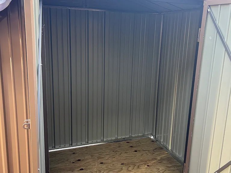 Brand new 6 x4 storage shed.
I covered it with a tarp due to the upcoming rain.