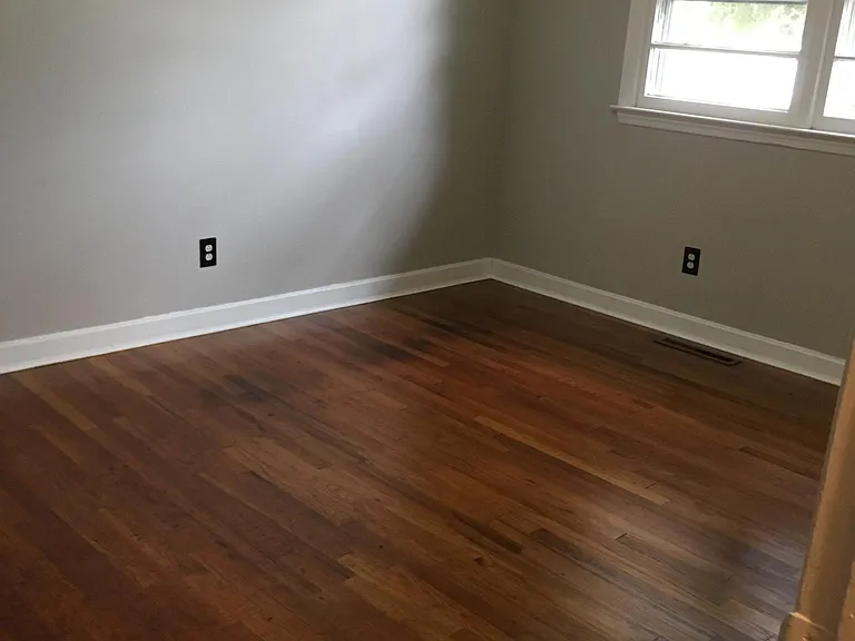 bedroom. This bedroom has a full bath and hardwood floors.