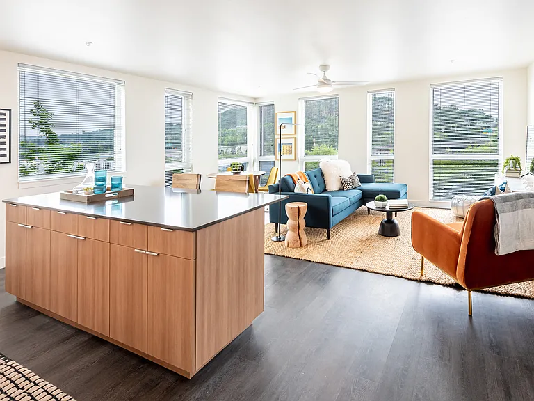 Large living room with an abundance of natural light,!