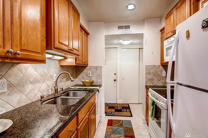 Kitchen now has stainless steel fridge