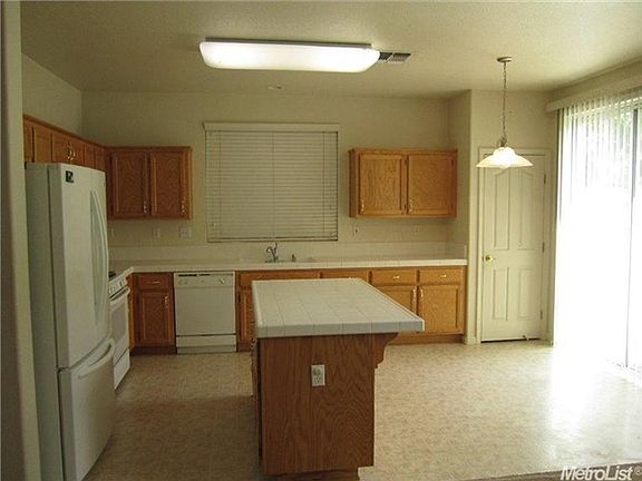 Kitchen includes fridge, stove, microwave, dishwasher, pantr