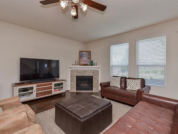 The corner fireplace brings warmth to the room on those chilly days. Perfect layout to set your furnishings with plenty of wall space for an entertainment center or mounted TV area.