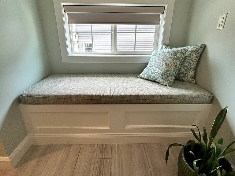 Seating and storage in Master Bathroom.