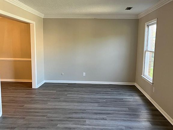 Very large living room with new flooring and freshly painted