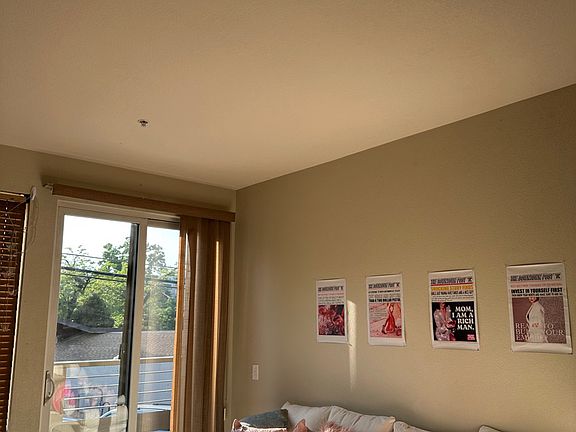 common area alongside the kitchen with balcony facing the flatirons