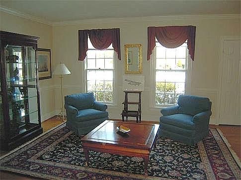 Living Room with Hardwood Floor and Crown Moldling