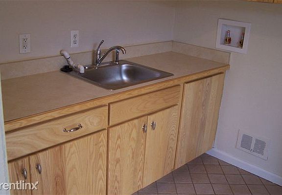 utility room, left view, has more cabinets than most kitchen