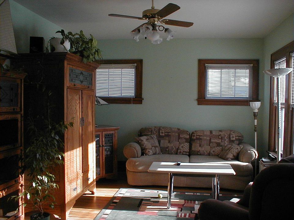 Windows by Andersen and original hardwood floors throughout. There is a sunroom adjacent to the living room.