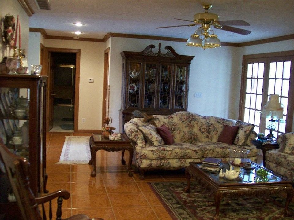 Living room has beautiful hardwood floors.