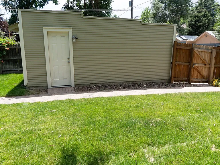 Detached single car garage with side entrance.