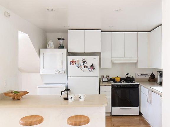 Kitchen with laundry and breakfast bar