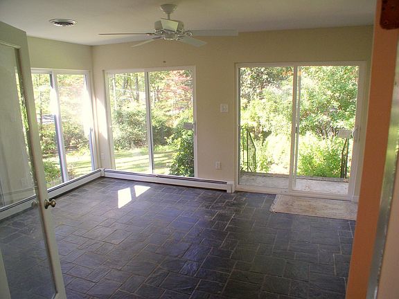 Sunroom with new sliding doors, fan & slate floor
