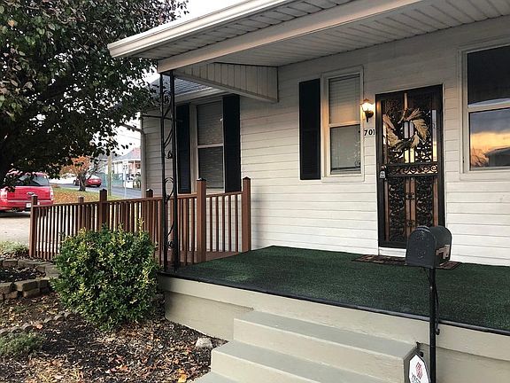 Front of the house, across the street from your coffee barista, Dose.