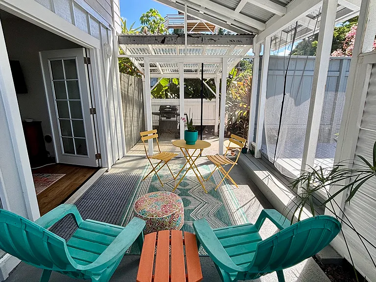 Outdoor living space. Covered Screened in Lani. Private entry with BBQ area