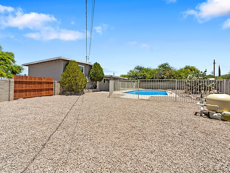 Large, fenced yard gives plenty of room to play, garden, or entertain.