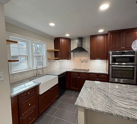 Gourmet kitchen with apron front farmhouse sink.