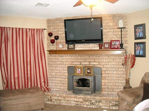 Living room with wood burning insert