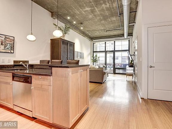 LOFT STYLE CONDO WITH EXTRA TALL CEILINGS!