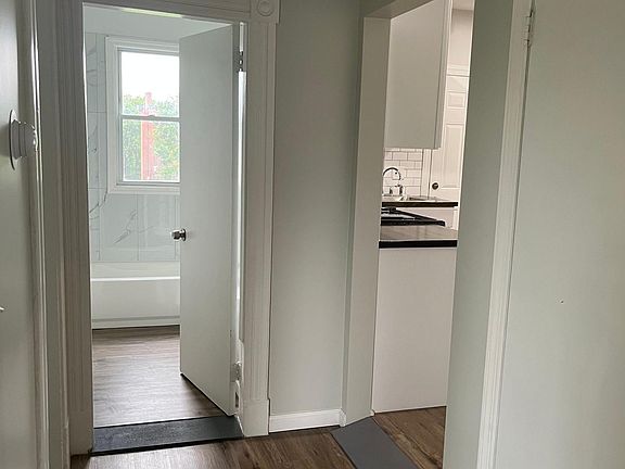 Hallway view to bathroom and kitchen