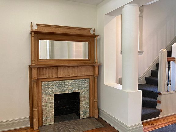 Foyer with historic fireplace