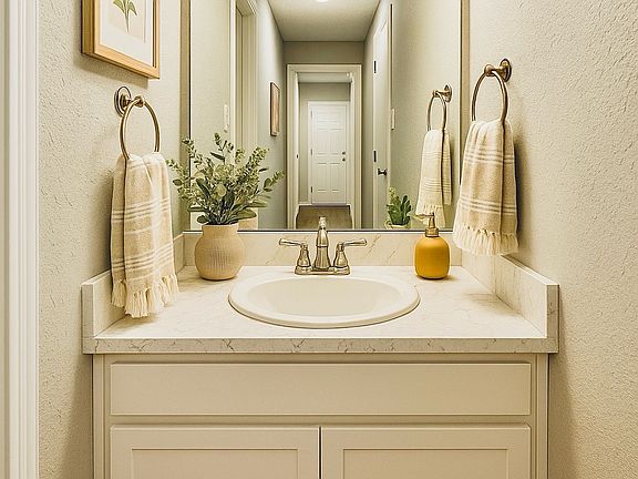 Guest-friendly and well-placed, this downstairs half bath adds everyday convenience with modern flair and quick access from all main-level rooms.