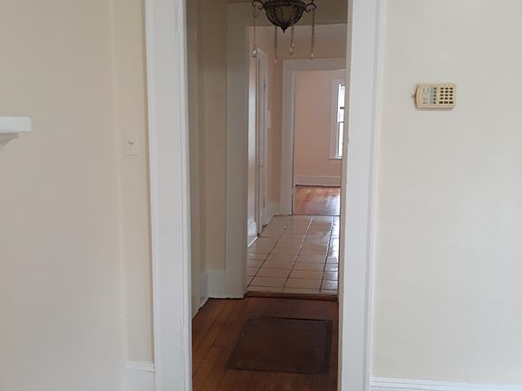 Hall with bathroom leading to kitchen